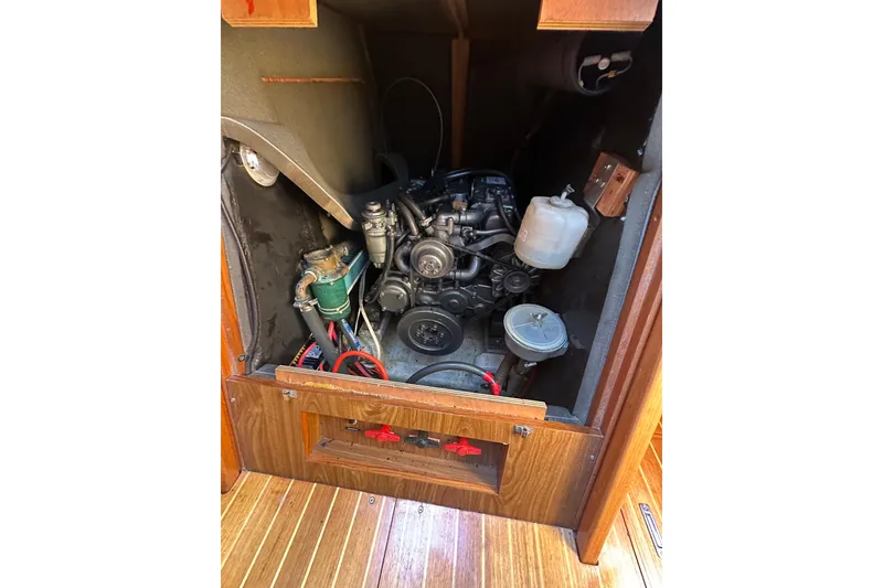 Slide: The Image of Engine compartment of 2002 Jeanneau Sun Odyssey 45.2 sailboat, showcasing mechanical components. - 29
