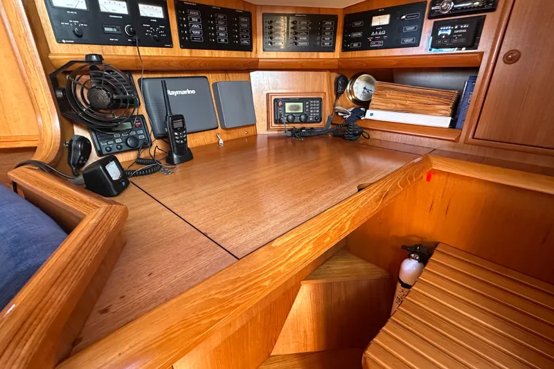 Slide: The Image of Navigation station on 2002 Jeanneau Sun Odyssey 45.2 yacht with communication equipment. - 31