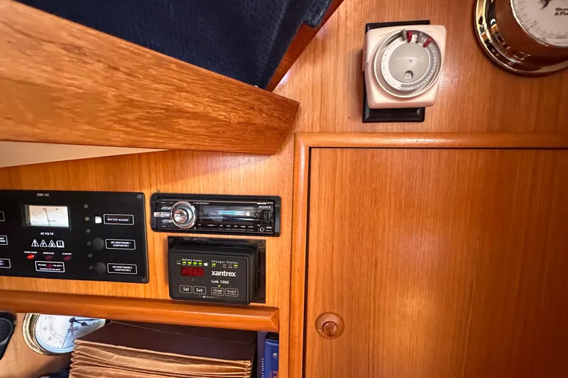 Slide: The Image of Control panel of 2002 Jeanneau Sun Odyssey 45.2 yacht with navigation instruments. - 32