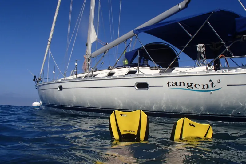 Slide: The Image of Jeanneau Sun Odyssey 45.2 sailboat on water, 2002 model, with diver fins visible. - 4