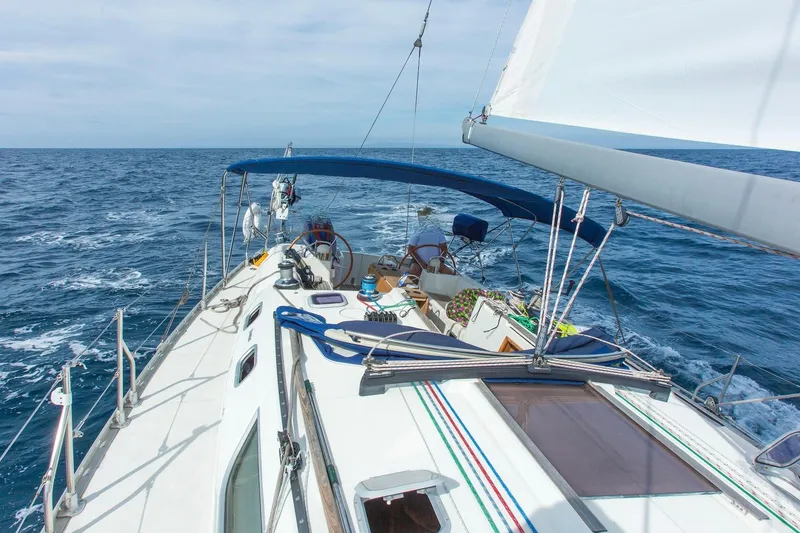 Slide: The Image of Sailing Jeanneau Sun Odyssey 45.2, 2002 model, on open sea with clear skies. - 5