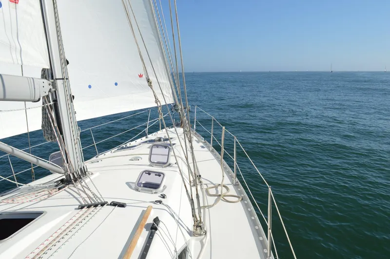 Slide: The Image of Sailing on Jeanneau Sun Odyssey 45.2, 2002 model, on open sea under clear skies. - 6