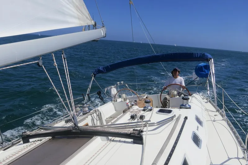 Slide: The Image of Sailing Jeanneau Sun Odyssey 45.2, 2002 model, on open sea with clear blue skies. - 7