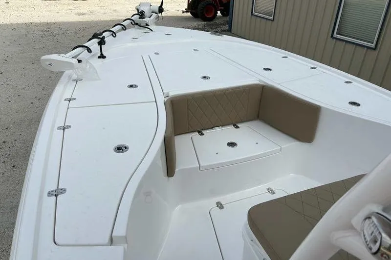 Slide: The Image of 2026 Blazer Bay 2700 Hybrid boat interior with cushioned seating and storage compartments. - 12