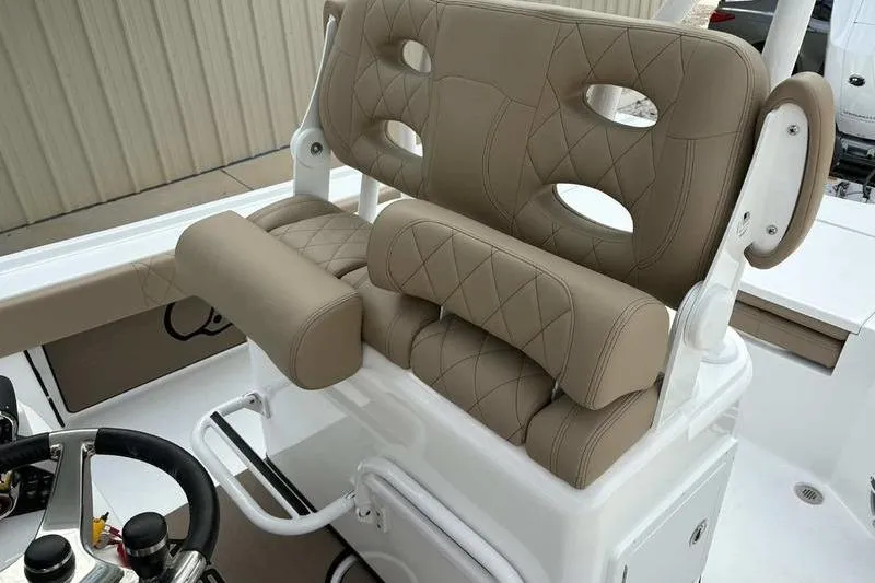 Slide: The Image of 2026 Blazer Bay 2700 Hybrid boat seat with tan upholstery and diamond stitching. - 16