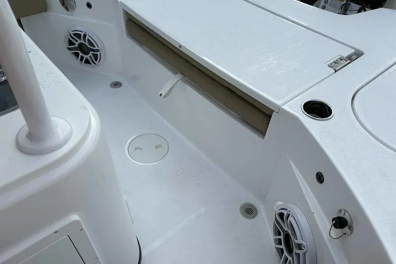 Slide: The Image of 2026 Blazer Bay 2700 Hybrid boat interior with speakers and storage compartments. - 19