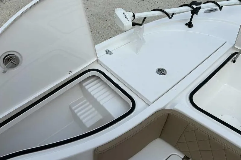 Slide: The Image of 2026 Blazer Bay 2700 Hybrid boat storage compartments and Garmin equipment. - 21