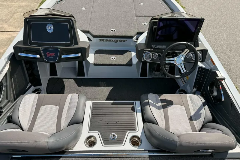 Slide: The Image of 2022 Ranger Z518 boat interior with dual seats, steering wheel, and control panel. - 4