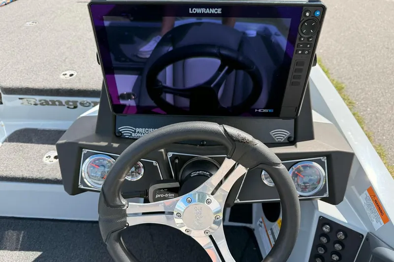 Slide: The Image of 2022 Ranger Z518 boat dashboard with Lowrance HDS display and steering wheel. - 6