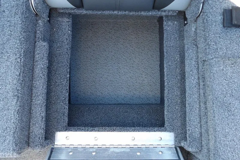 Slide: The Image of Carpeted storage compartment in 2026 Lund 2075 Impact XS boat. - 13