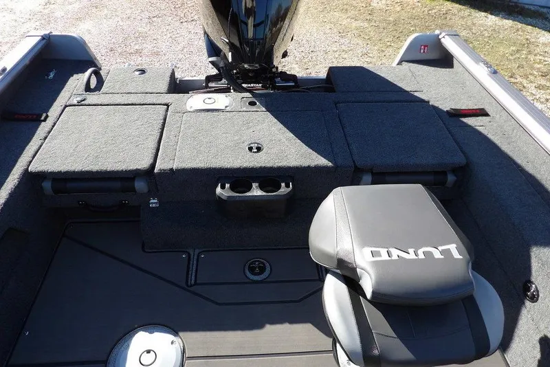 Slide: The Image of 2026 Lund 2075 Impact XS boat interior with seating and storage compartments. - 15