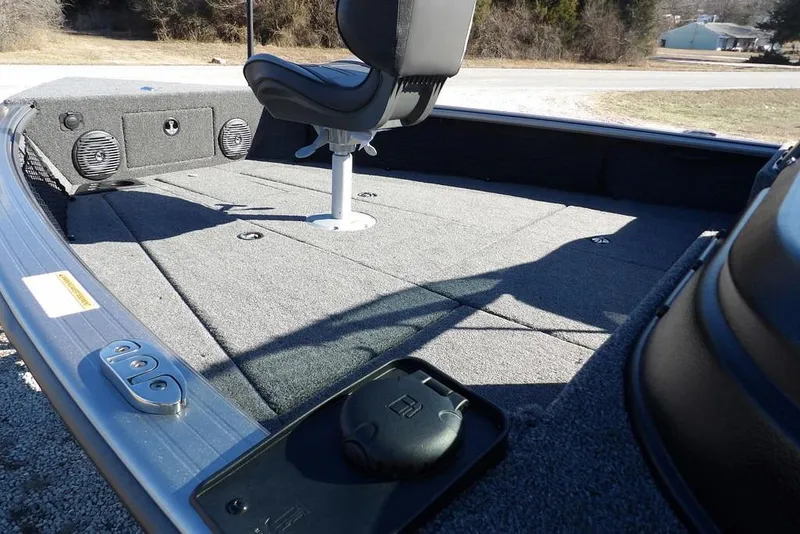 Slide: The Image of 2026 Lund 2075 Impact XS boat interior with seating and storage compartments. - 16