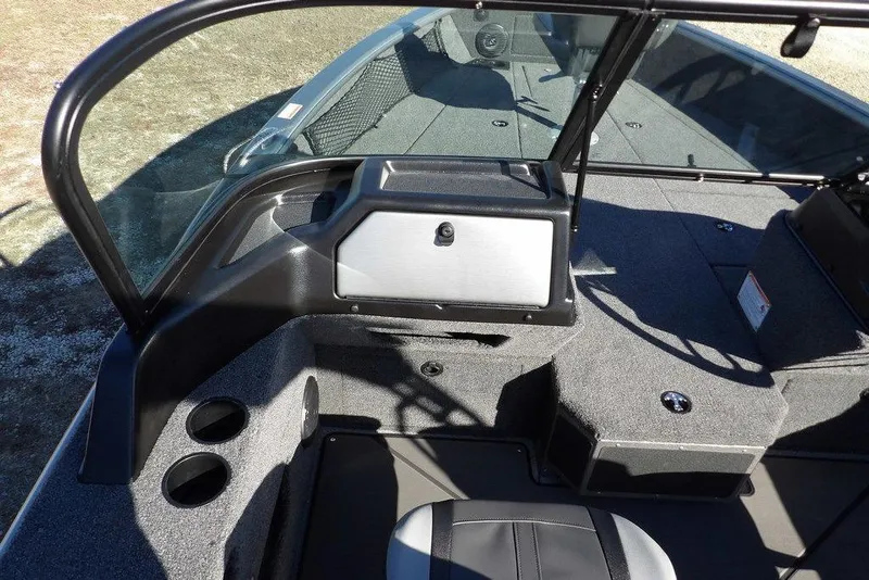 Slide: The Image of 2026 Lund 2075 Impact XS boat interior with seating and storage compartments. - 36