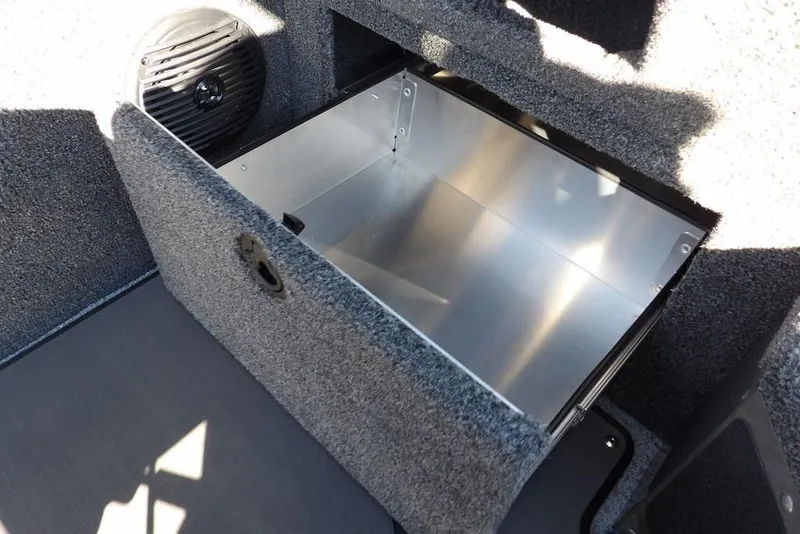 Slide: The Image of 2026 Lund 2075 Impact XS boat storage compartment with speaker, open and empty. - 37