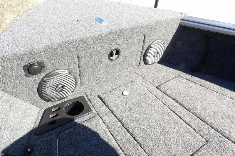 Slide: The Image of 2026 Lund 2075 Impact XS boat interior with speakers and storage compartments. - 47