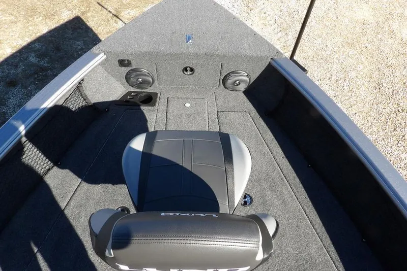 Slide: The Image of 2026 Lund 2075 Impact XS boat interior with seating and speaker system. - 48