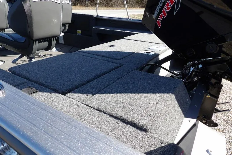 Slide: The Image of 2026 Lund 2075 Impact XS boat interior with seating and motor detail. - 5