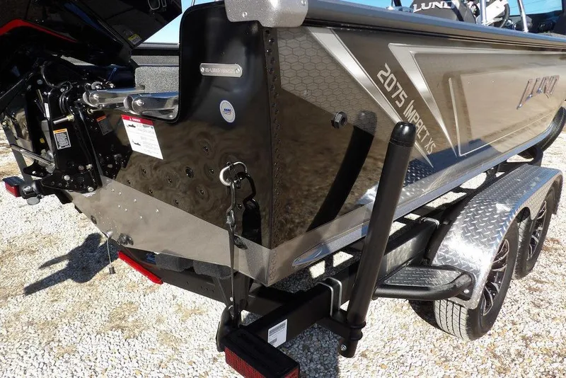 Slide: The Image of 2026 Lund 2075 Impact XS boat on trailer, rear view, metallic finish. - 50