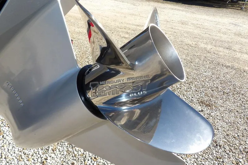 Slide: The Image of Close-up of a Mercury Marine propeller on a 2026 Lund 2075 Impact XS boat. - 56