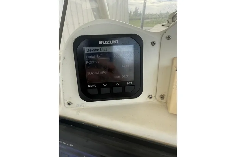 Slide: The Image of Suzuki device display on 2009 Atlantic 275 CC boat dashboard. - 11