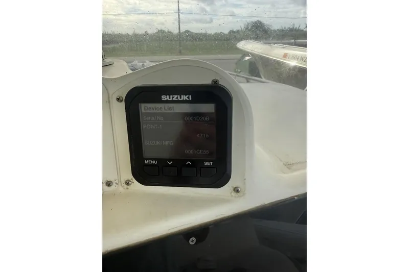 Slide: The Image of Suzuki device display on 2009 Atlantic 275 CC boat dashboard. - 12