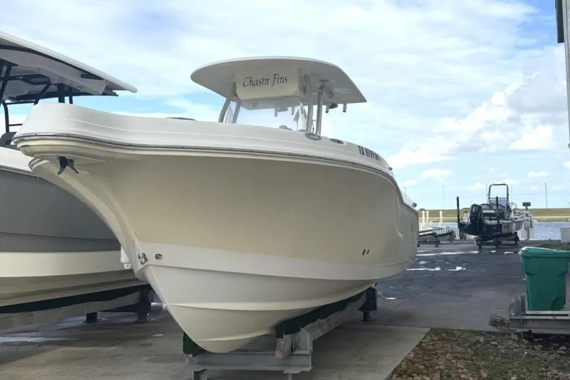 Slide: The Image of 2009 Atlantic 275 CC boat on dock, clear sky background. - 4
