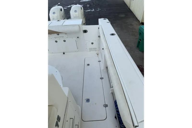 Slide: The Image of 2009 Atlantic 275 CC boat deck with dual Suzuki outboard motors. - 6