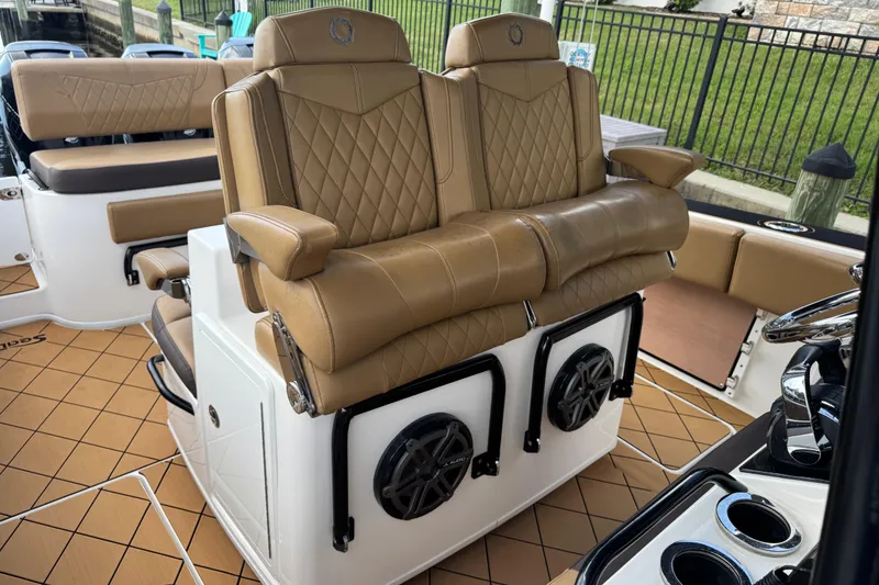 Slide: The Image of Luxurious seating on 2020 Fountain 38 Center Console boat with tan leather upholstery. - 13