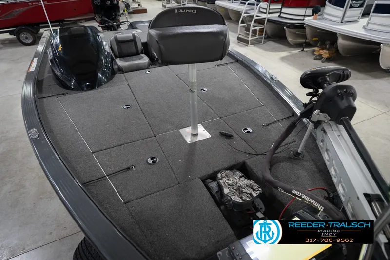 Slide: The Image of 2020 Lund 1875 Pro-V Bass boat interior with fishing deck and seating. - 12