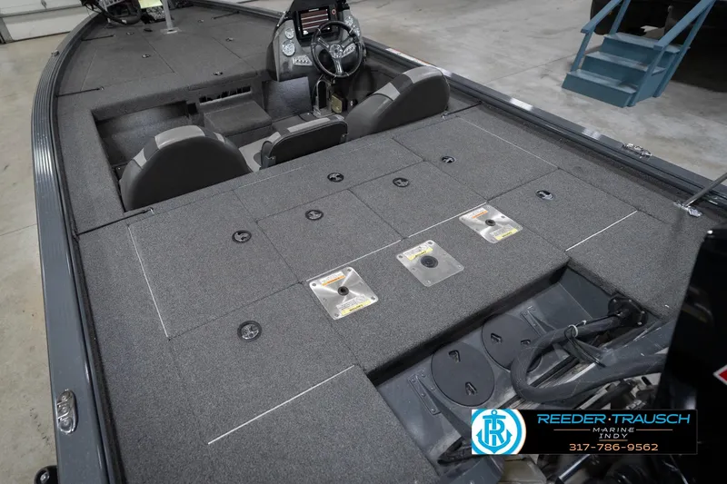 Slide: The Image of 2020 Lund 1875 Pro-V Bass boat interior with seating and storage compartments. - 14