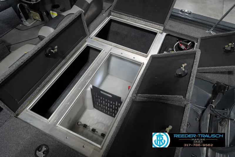 Slide: The Image of 2020 Lund 1875 Pro-V Bass boat interior storage compartments open. - 22