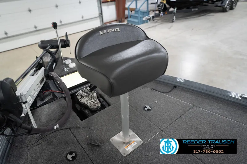 Slide: The Image of 2020 Lund 1875 Pro-V Bass boat seat in a showroom setting. - 25