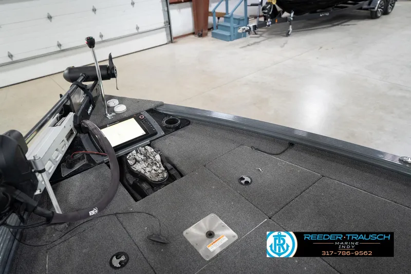 Slide: The Image of 2020 Lund 1875 Pro-V Bass boat interior with navigation equipment in a showroom. - 26