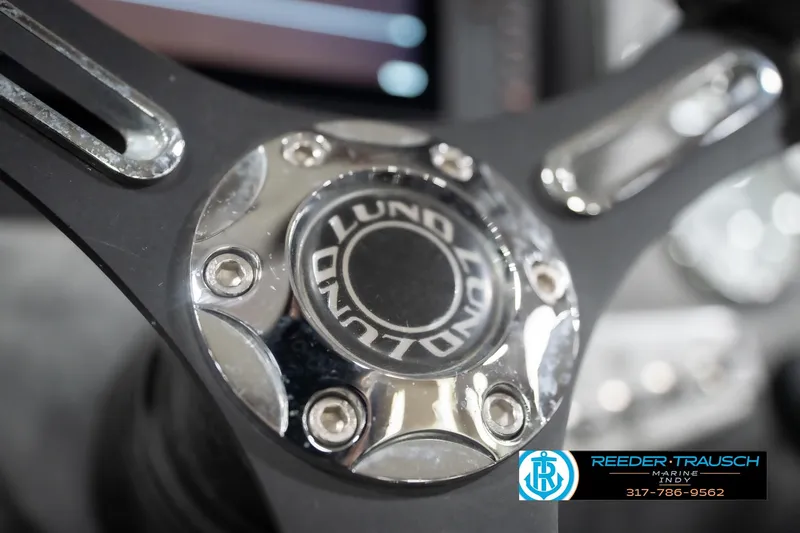 Slide: The Image of Close-up of 2020 Lund 1875 Pro-V Bass steering wheel with Reeder-Trausch Marine logo. - 29