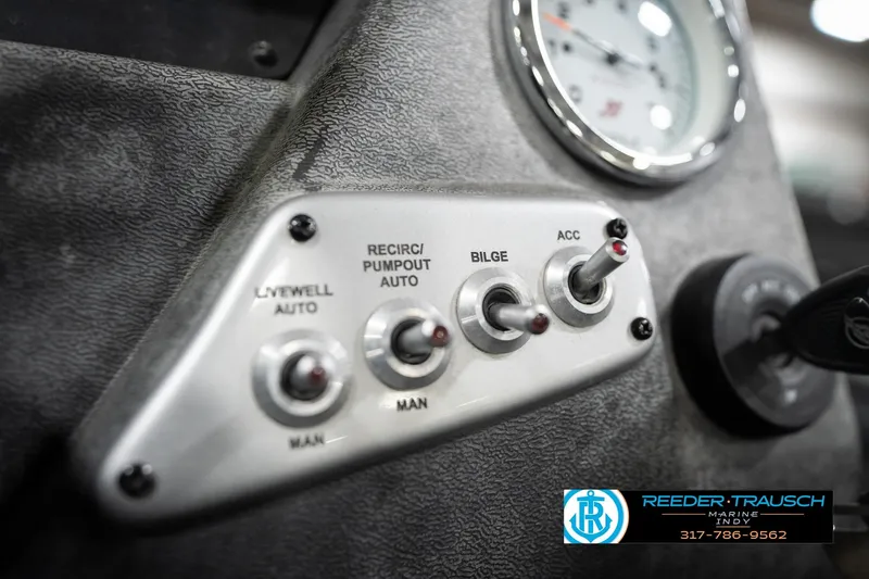 Slide: The Image of Control panel of 2020 Lund 1875 Pro-V Bass boat with switches and gauge. - 34