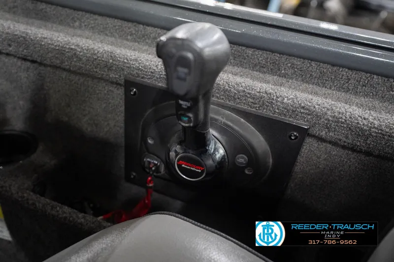 Slide: The Image of 2020 Lund 1875 Pro-V Bass boat throttle control, Reeder-Trausch Marine branding visible. - 35