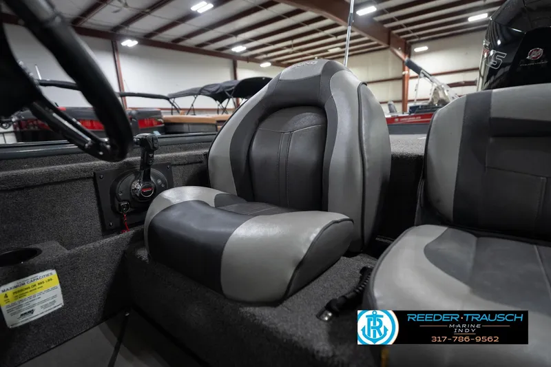 Slide: The Image of 2020 Lund 1875 Pro-V Bass boat interior with gray seating and steering wheel. - 36