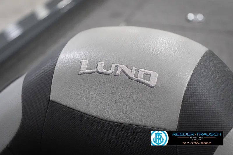 Slide: The Image of 2020 Lund 1875 Pro-V Bass boat seat with logo, featuring gray and black upholstery. - 37