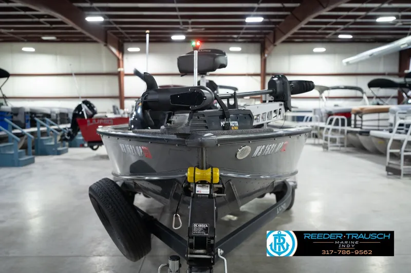 Slide: The Image of 2020 Lund 1875 Pro-V Bass boat in showroom, featuring Minn Kota motor. - 4