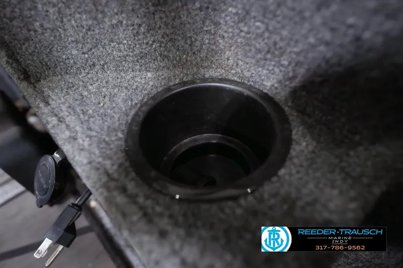 Slide: The Image of 2020 Lund 1875 Pro-V Bass boat cup holder and power outlet detail. - 40