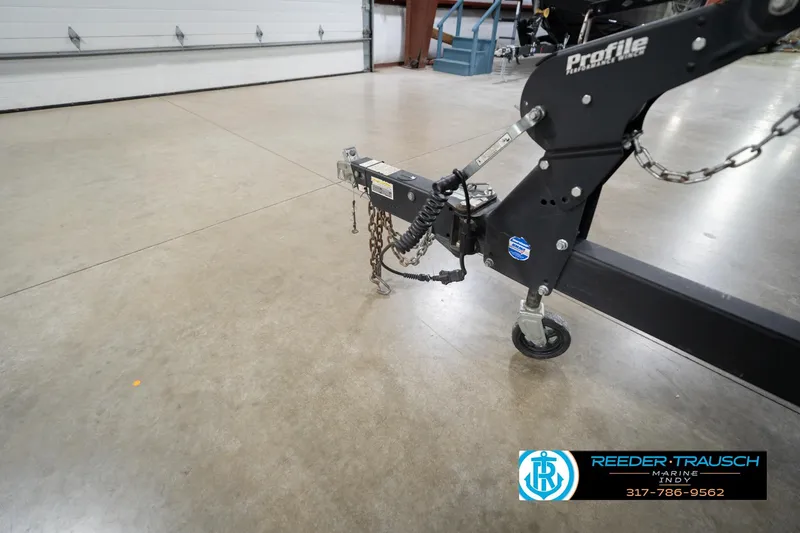 Slide: The Image of Trailer hitch of a 2020 Lund 1875 Pro-V Bass boat in a showroom. - 55