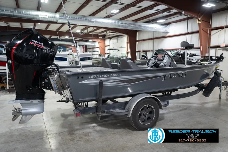 Slide: The Image of 2020 Lund 1875 Pro-V Bass boat with Mercury Pro XS engine in showroom. - 7