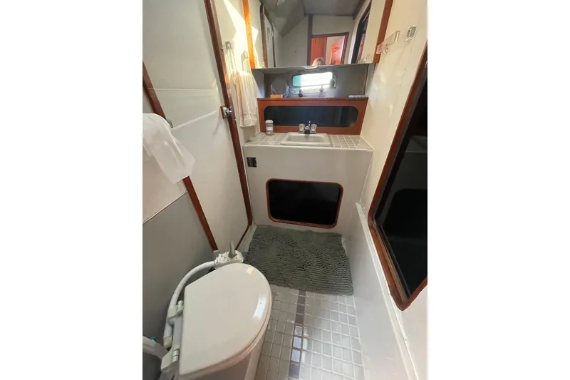 Slide: The Image of Bathroom interior of 1988 Bayliner 3888 Motoryacht with sink and toilet. - 20