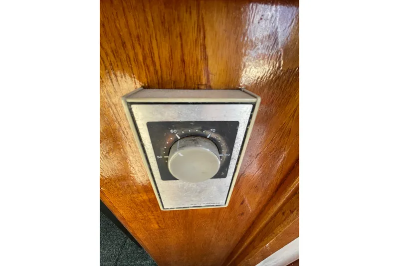 Slide: The Image of Thermostat dial on 1988 Bayliner 3888 Motoryacht wooden panel. - 22