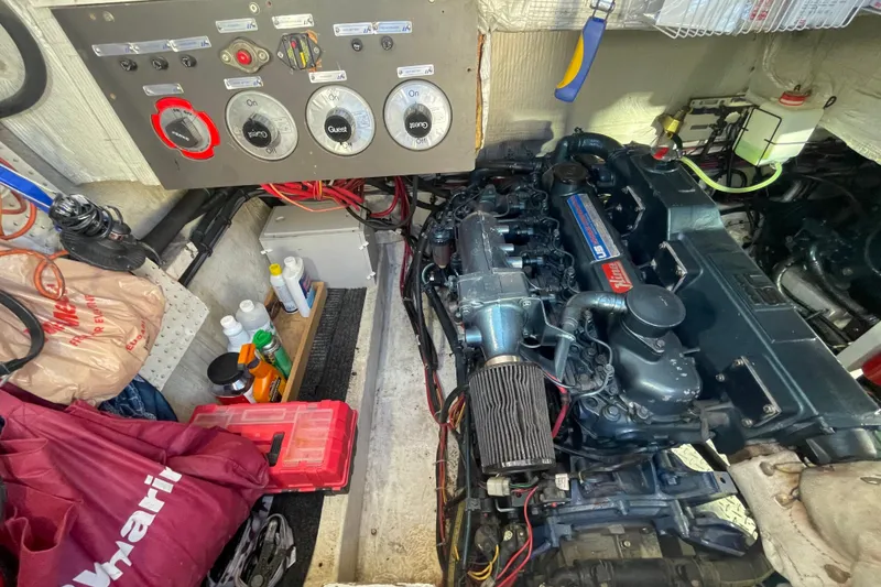 Slide: The Image of Engine room of 1988 Bayliner 3888 Motoryacht with control panel and maintenance supplies. - 29