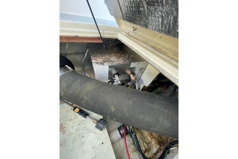 Slide: The Image of Engine compartment of 1988 Bayliner 3888 Motoryacht with visible components and wiring. - 31