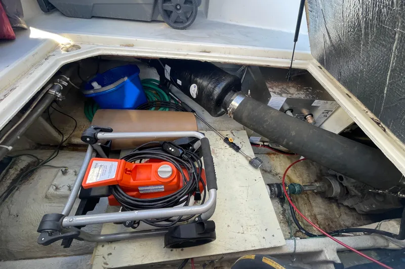 Slide: The Image of Engine compartment of 1988 Bayliner 3888 Motoryacht with tools and equipment. - 32