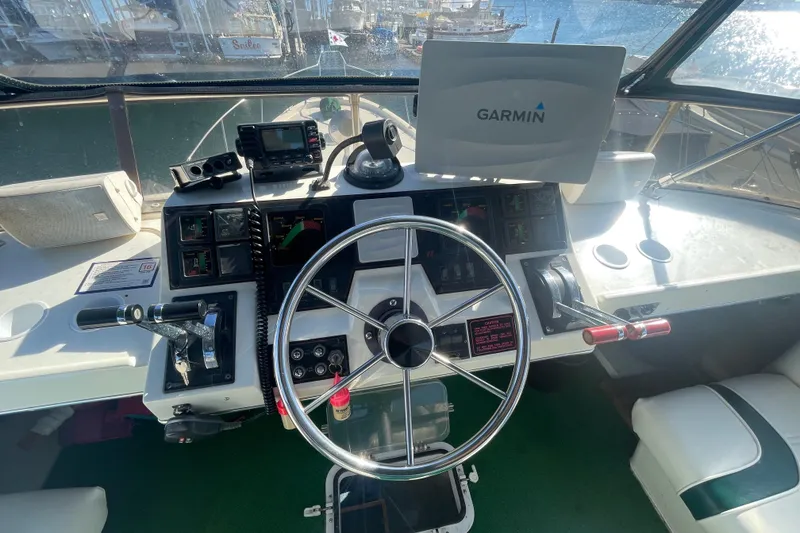 Slide: The Image of Cockpit of 1989 Bayliner 3888 Motoryacht with Garmin navigation system and steering wheel. - 5
