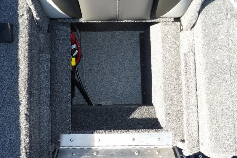 Slide: The Image of Open storage compartment in 2026 Lund 2075 Impact XS boat interior. - 12