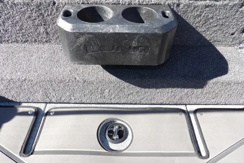 Slide: The Image of 2026 Lund 2075 Impact XS boat interior with cup holder and deck detail. - 17